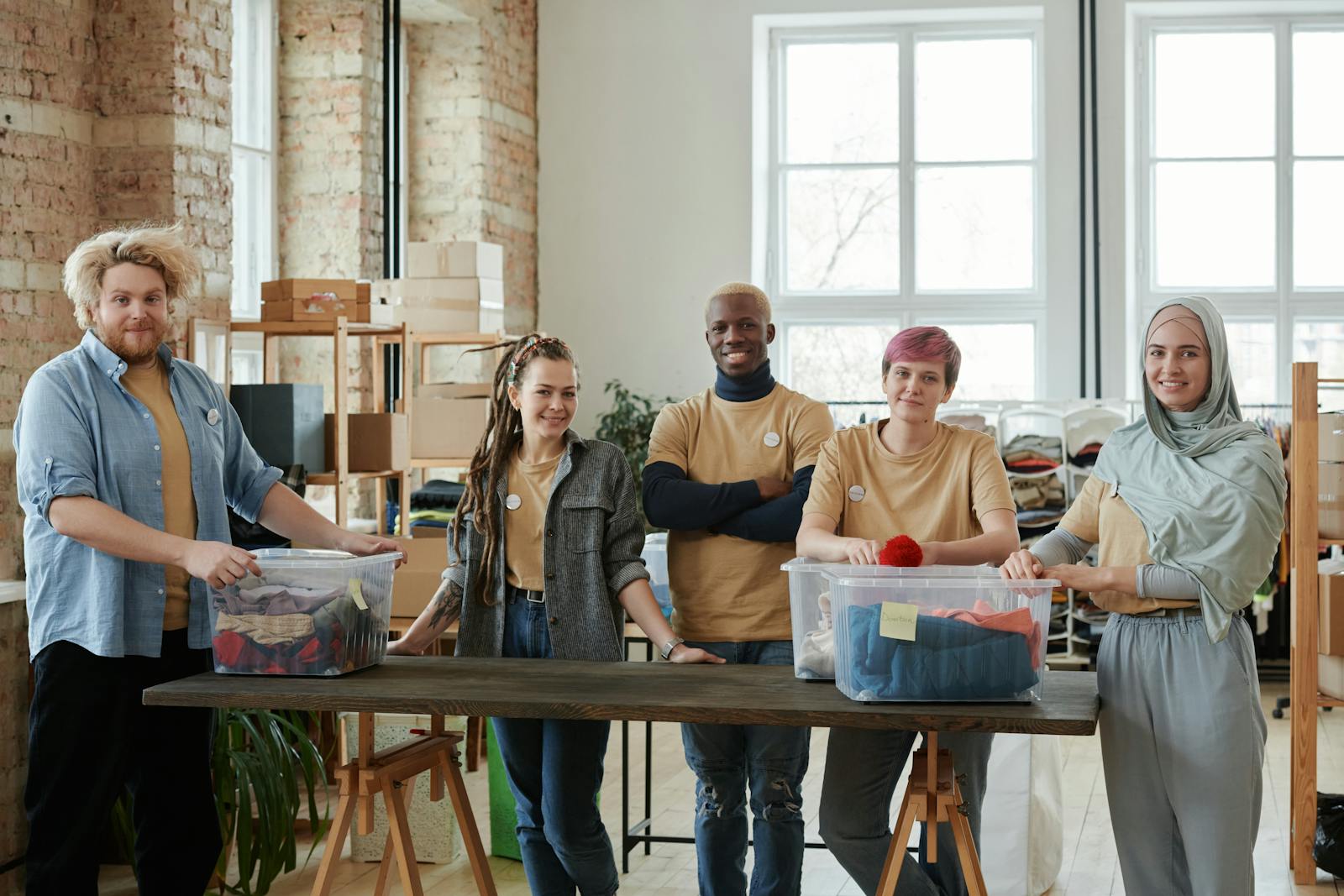 Community members sorting donated items in a shared workspace